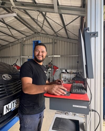 Billy Reid, co-owner of Tyre Save Direct, at the wheel alignment computer in the Kerikeri workshop