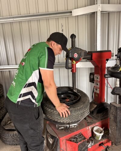 Technician fitting a tyre on the tyre changing machine at Tyre Save Direct, Kerikeri