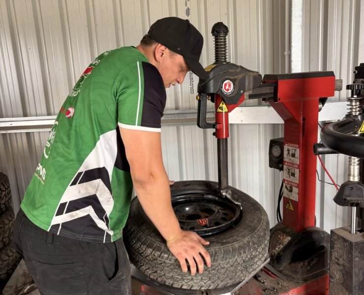 Technician fitting a tyre on the tyre changing machine at Tyre Save Direct, Kerikeri