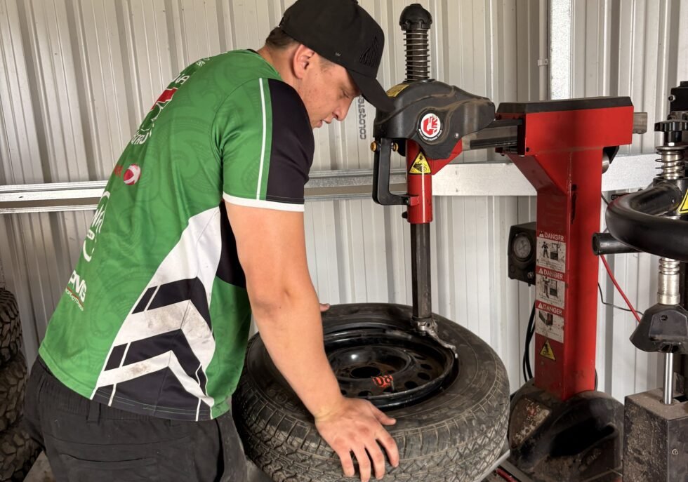 Technician fitting a tyre on the tyre changing machine at Tyre Save Direct, Kerikeri