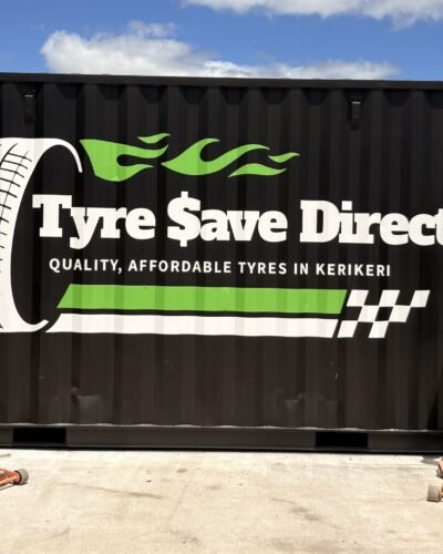Billy and George outside the Tyre Save Direct branded container workshop in Kerikeri