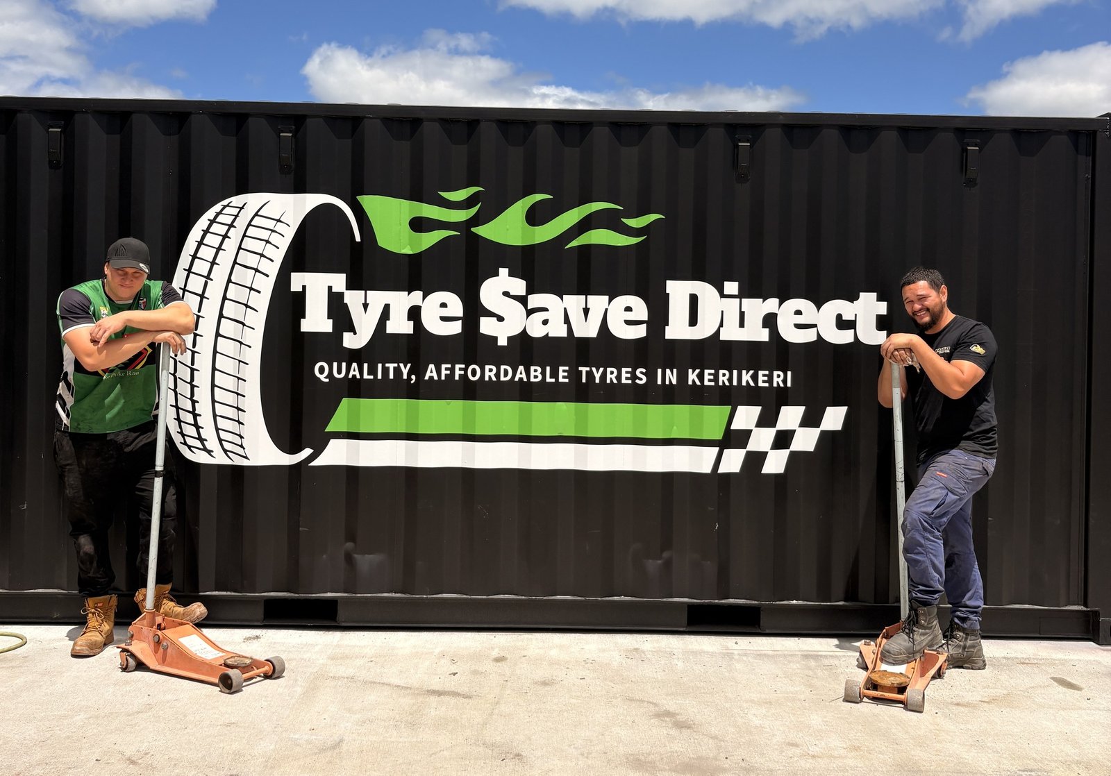 Billy and George outside the Tyre Save Direct branded container workshop in Kerikeri